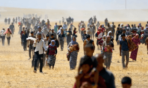 Yezidis trapped in the Sinjar mountains being rescued in 2014. Photo GETTY IMAGES